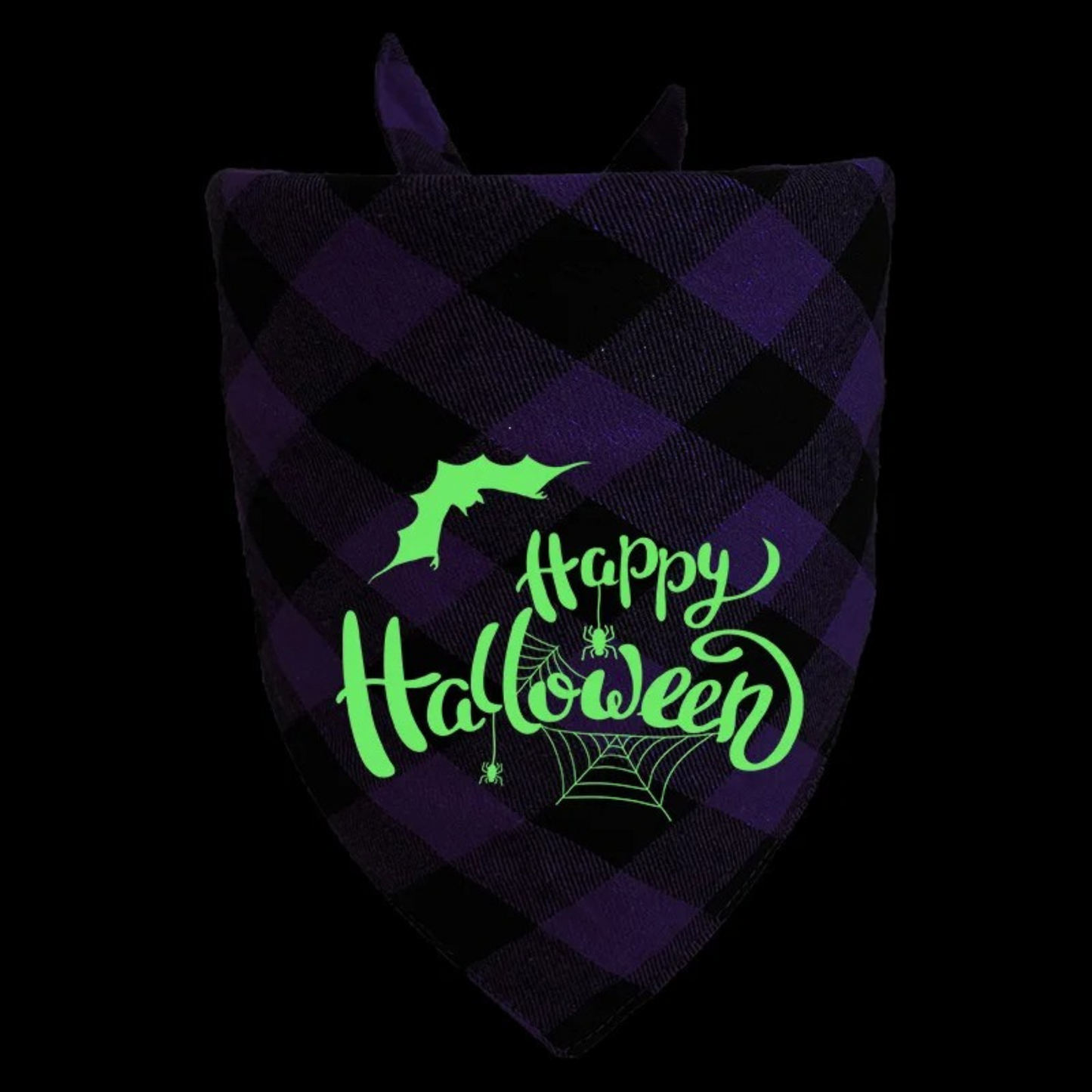 Glowing 'Happy Halloween' text on a purple and black checkered fabric with a bat and spider design.