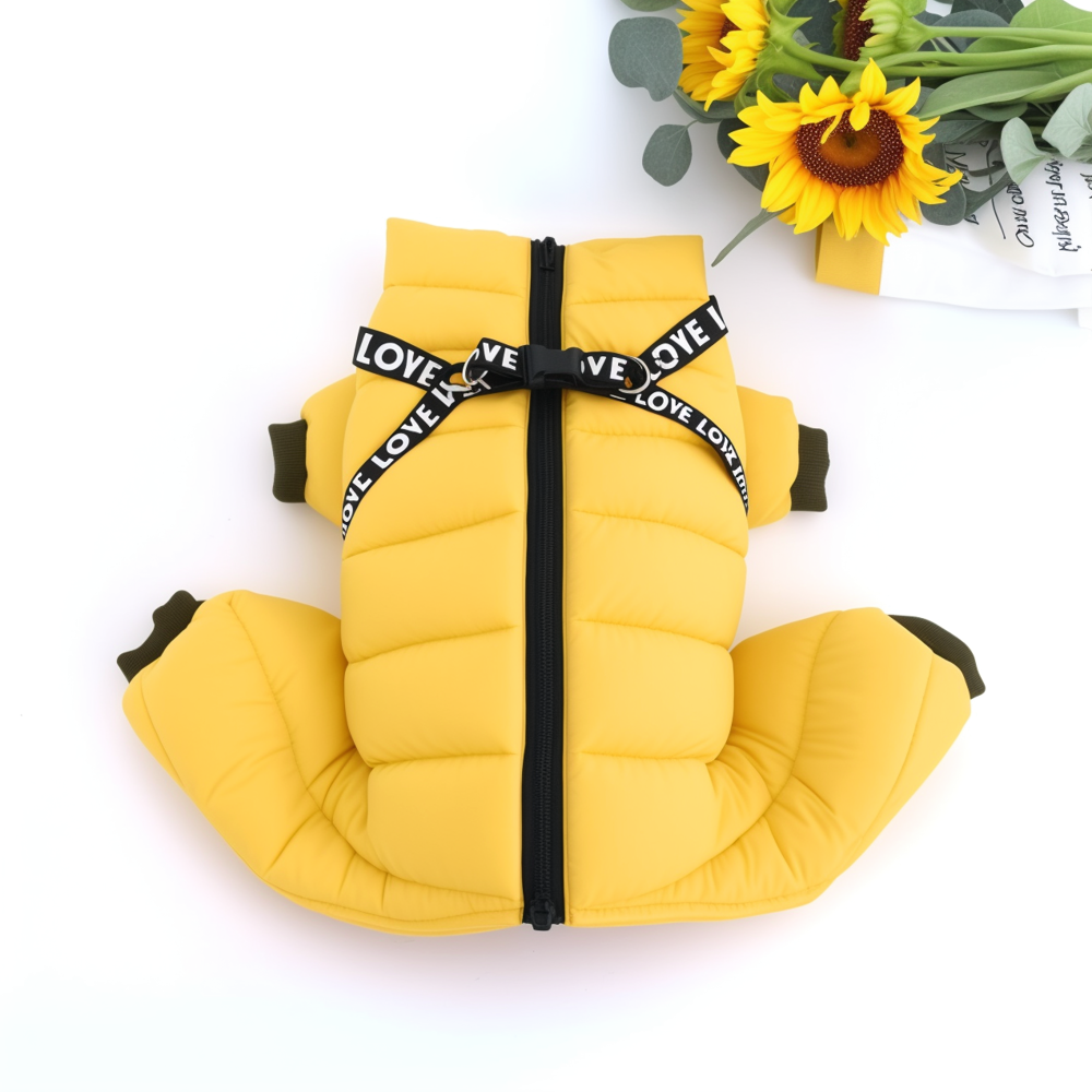 Yellow pet vest with black straps on a white background with sunflowers.