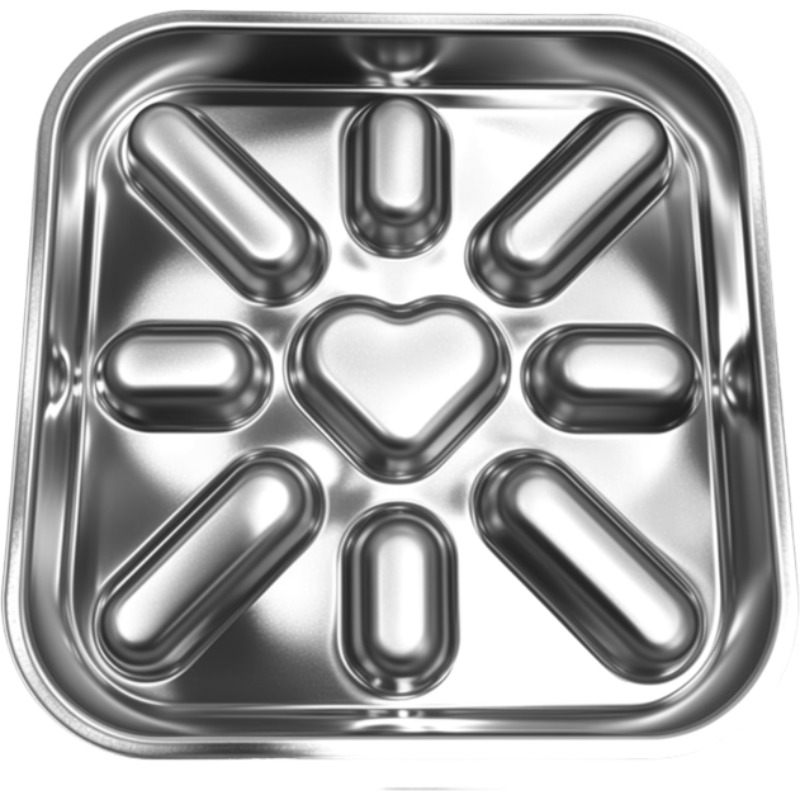 Stainless steel tray with heart and oval compartments on a white background
