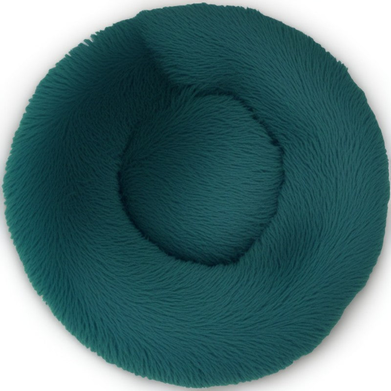 Cyan round calming pet bed for dogs and cats, plush donut design for comfort and coziness.
