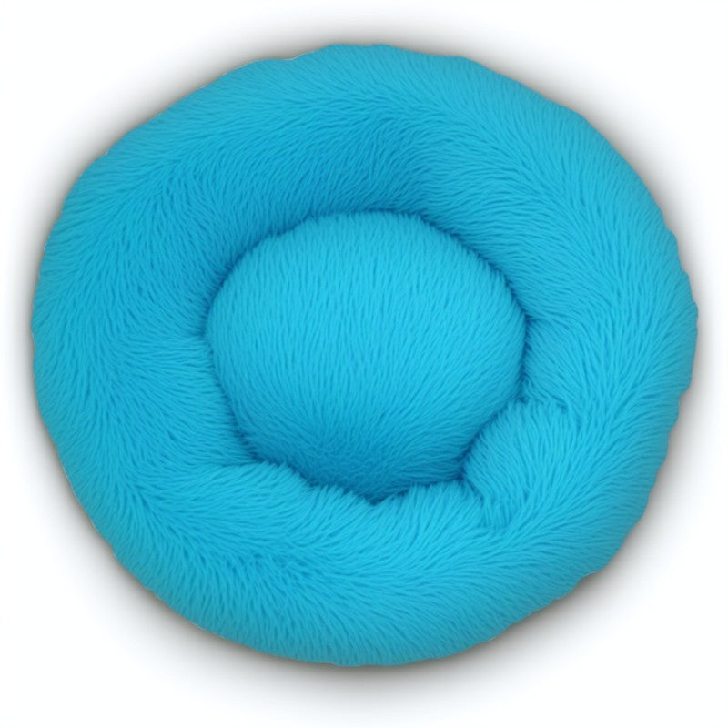 Bright blue calming donut bed for dogs and cats, made with soft plush and secure bolstered edges.