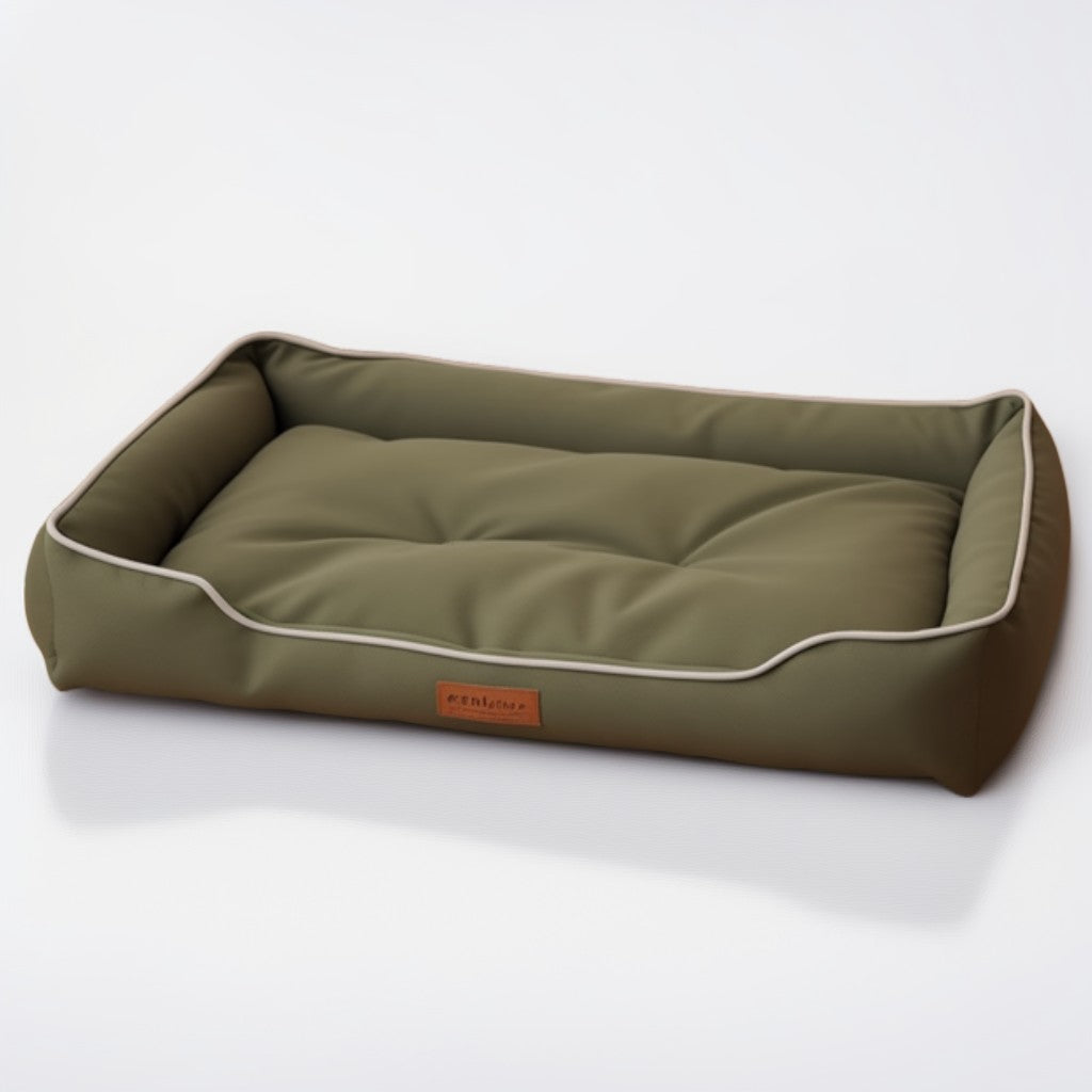 Olive green waterproof dog bed with light piping trim and plush padding.