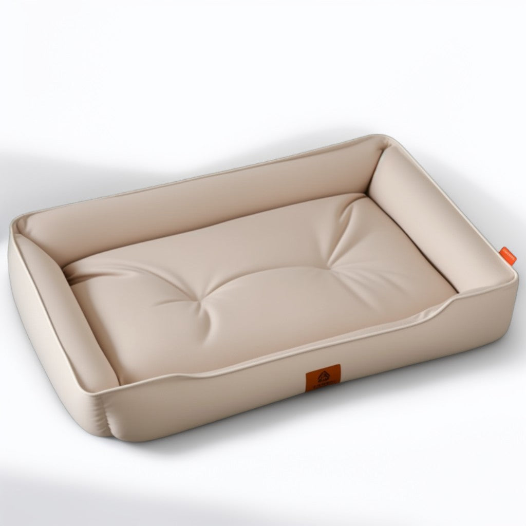 Beige waterproof dog bed with raised sides and soft padded interior.