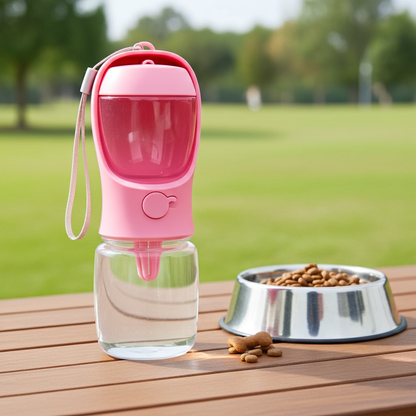Pink pet water bottle with a clear container on a wooden table outdoors.