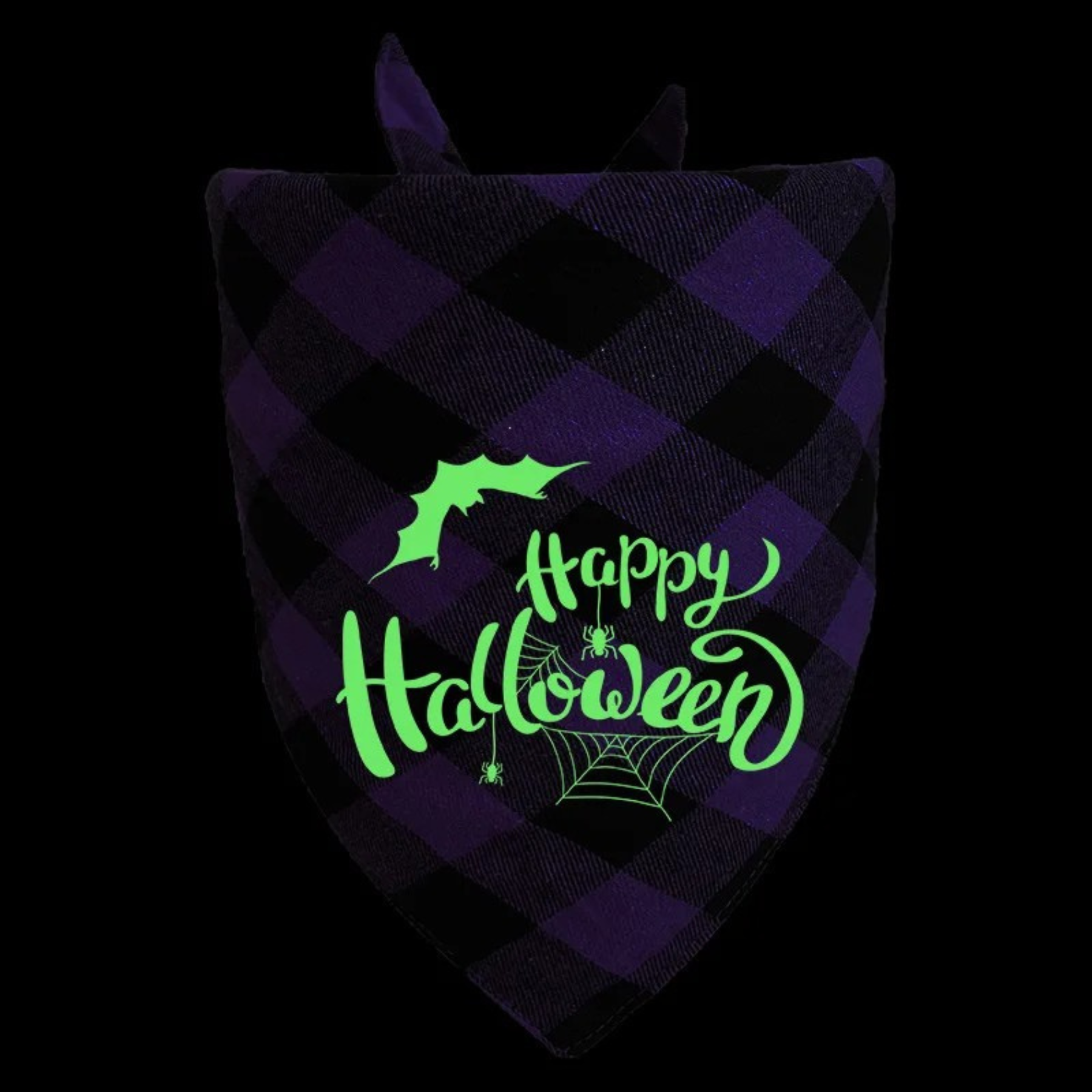 Glowing 'Happy Halloween' text on a purple and black checkered fabric with a bat and spider design.