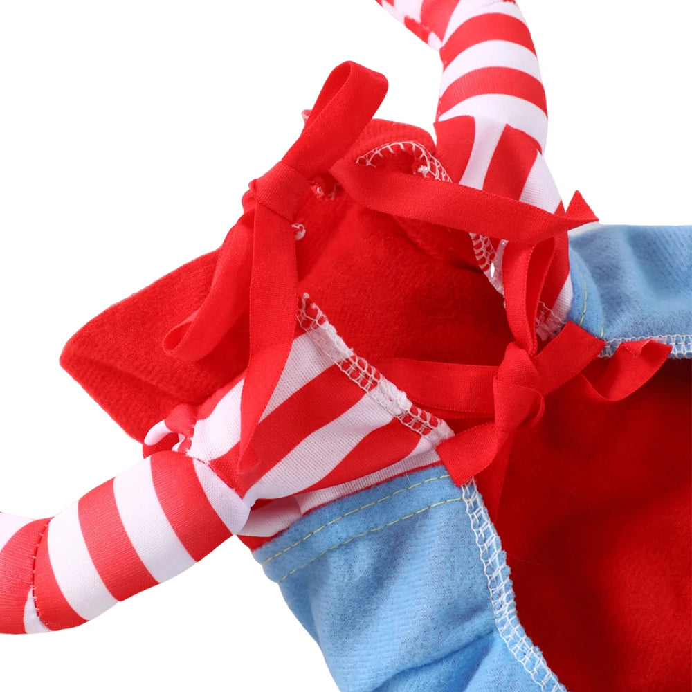 Close-up of a red and white striped candy cane with blue fabric and a bow on a white background