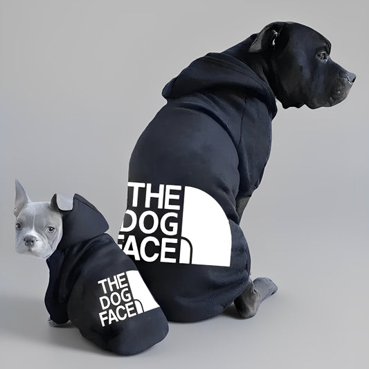 Two dogs wearing 'The Dog Face' hoodies on a gray background