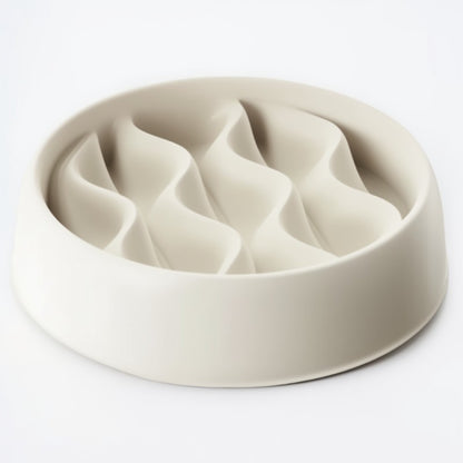 Beige ceramic pet bowl with divided sections on a white background