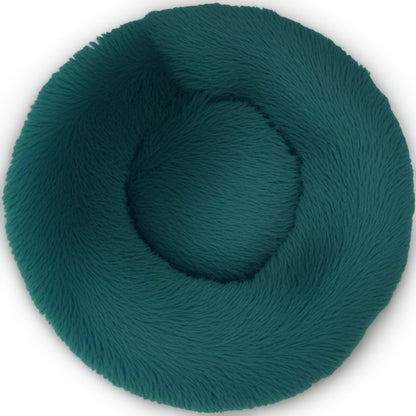 Cyan round calming pet bed for dogs and cats, plush donut design for comfort and coziness.