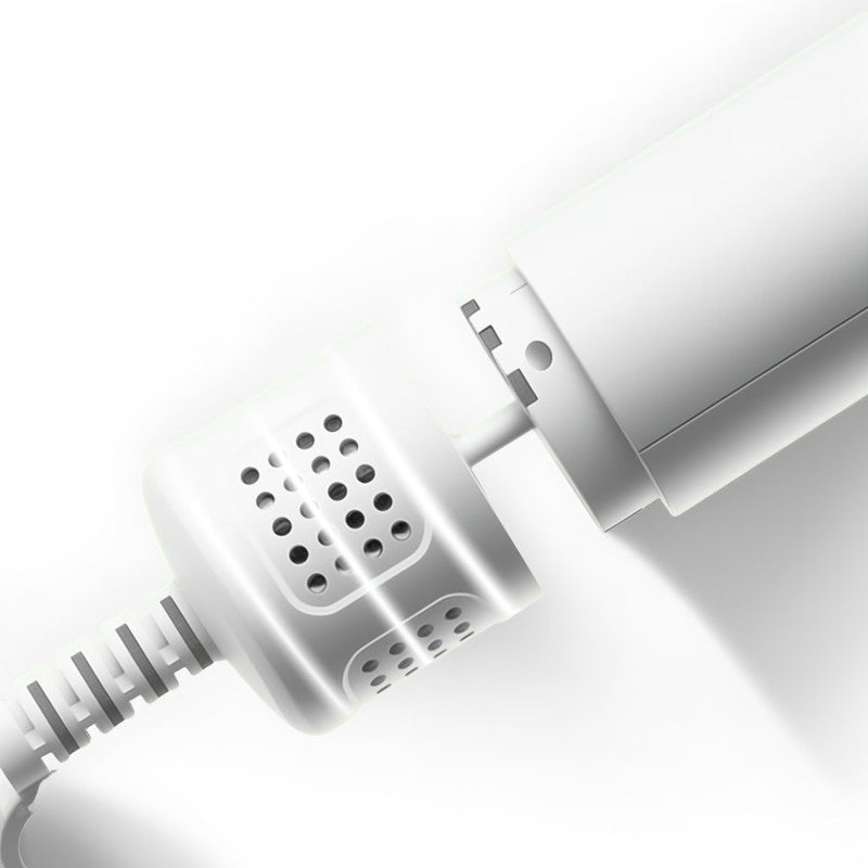 Close-up of a white electronic device with a cable on a light gray background