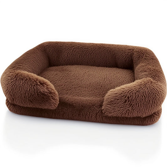 Brown sofa-style furry dog bed — rectangular plush pet sofa with supportive bolster sides and cozy, washable cover.