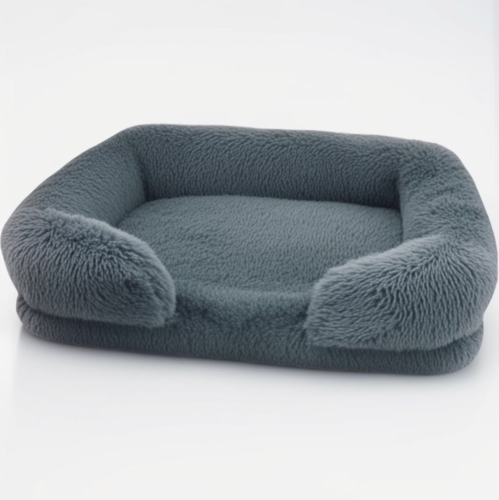 Charcoal grey sofa-style furry dog bed — rectangular plush design with bolster sides and anti-slip base.