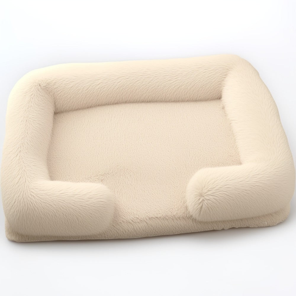 Beige sofa-style furry dog bed — cozy rectangular plush bed with raised bolsters, removable cover and anti-slip base.