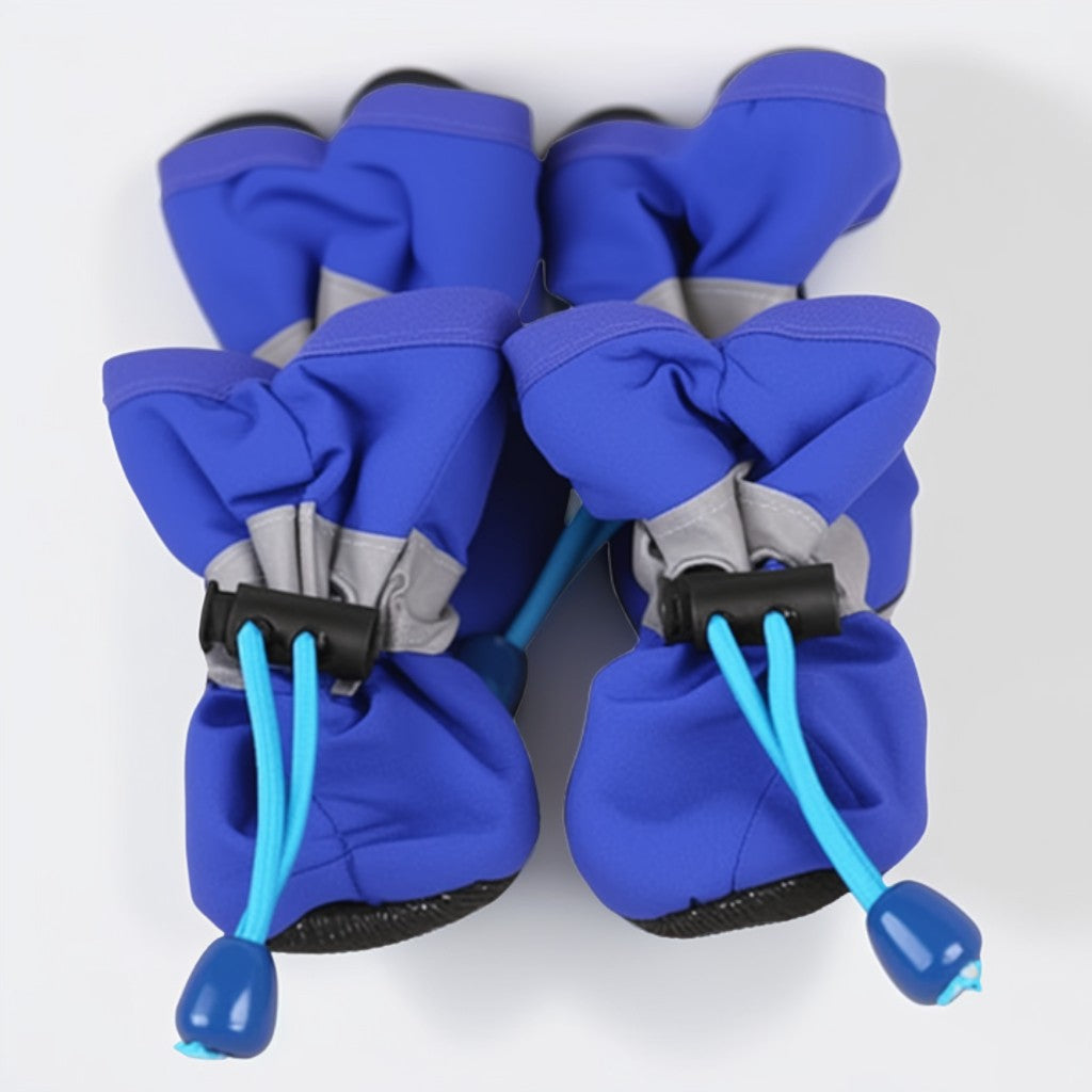 Pair of blue dog boots with blue straps on a white background