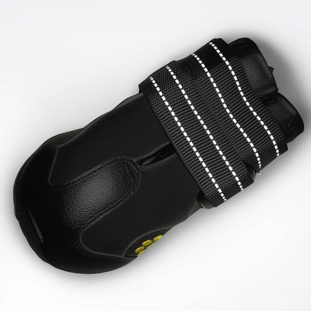 Black glove with a strap on a white background