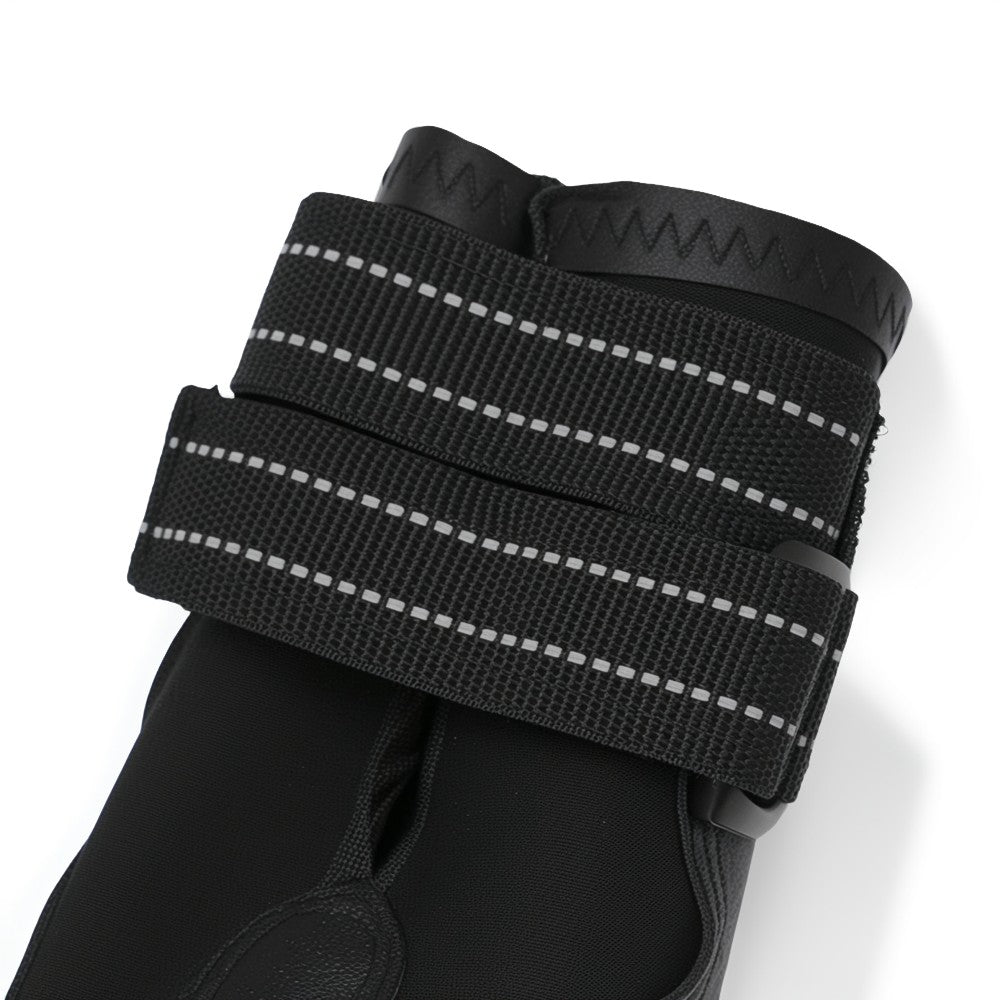 Black glove with reflective straps on a white background